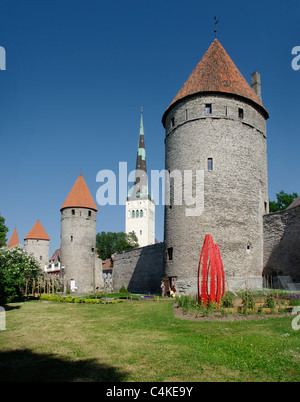 Tallinn City Wall With Towers, Koismäe Torn In Front Of and ST.Olaf`s Church In the Background Stock Photo